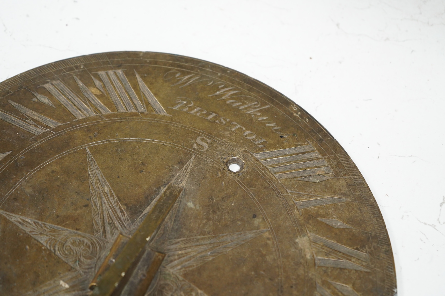 A William IV brass sundial, engraved W. Watkins, Bristol and J Coley, Somerset, 25cm in diameter, the low angle of the gnomon might indicate use in a tropical longitude
